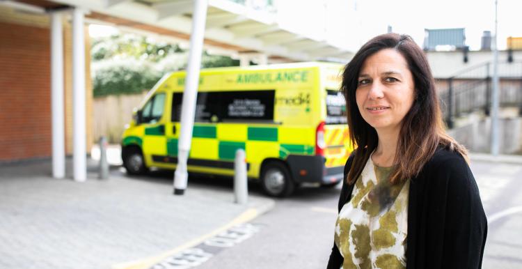 Woman standing in the ambulance bay of an A&E