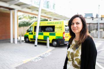 Woman standing in the ambulance bay of an A&E